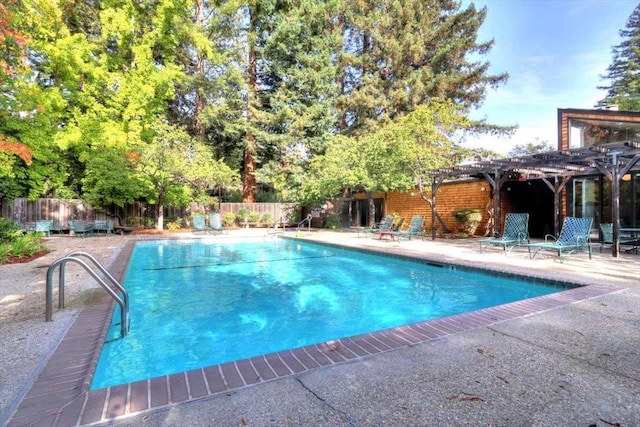 view of swimming pool with a pergola and a patio area