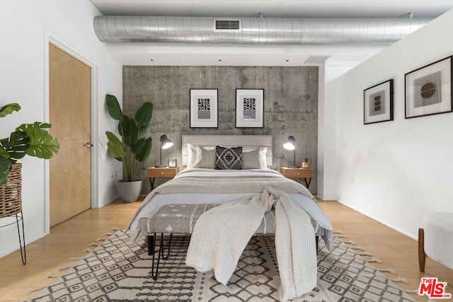 bedroom featuring light wood-type flooring