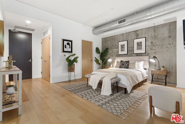 bedroom featuring light hardwood / wood-style floors