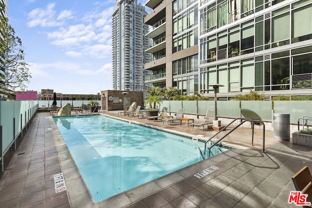 view of pool featuring a patio