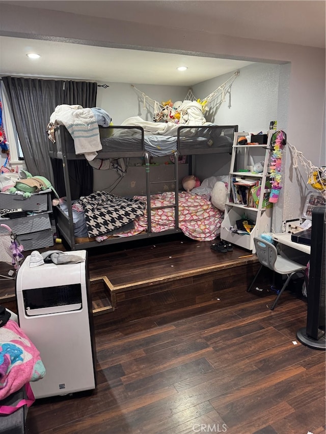 bedroom with wood-type flooring