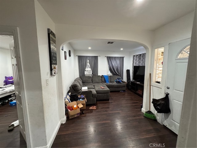 living room featuring dark wood-type flooring