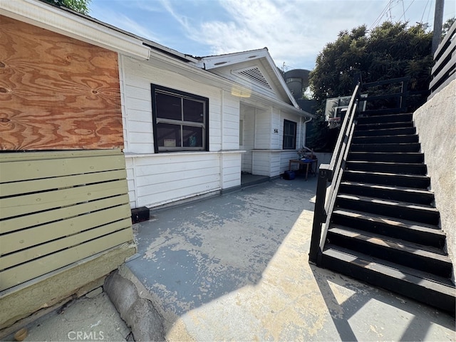 view of side of property with a patio area