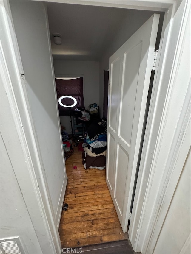 hall with dark wood-type flooring