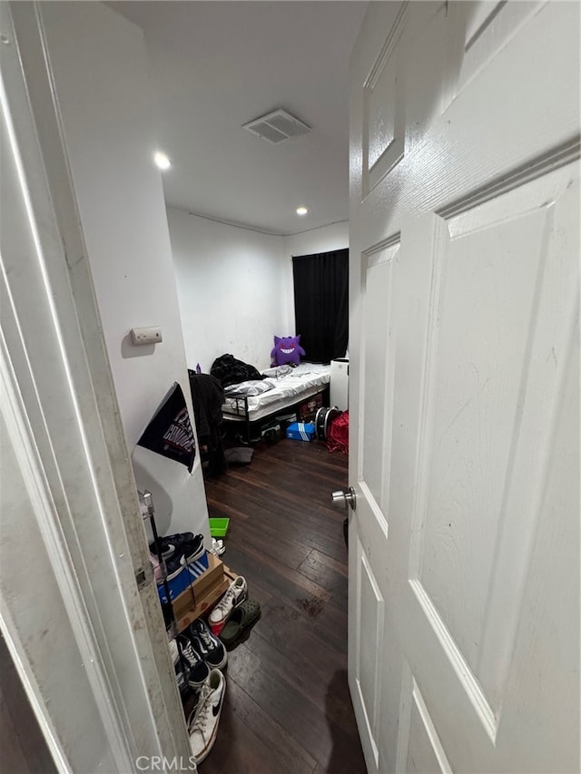 hallway featuring dark wood-type flooring