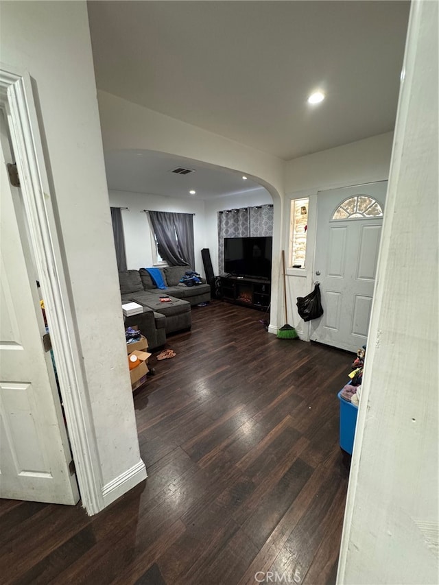 foyer entrance with dark hardwood / wood-style floors