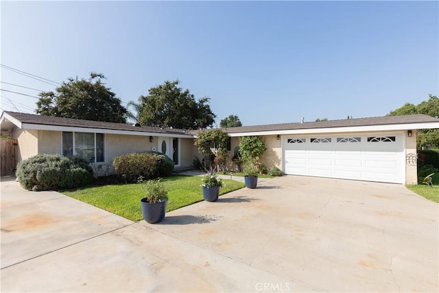 ranch-style house with a garage and a front yard