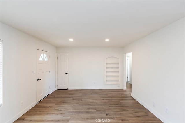 foyer entrance with wood-type flooring