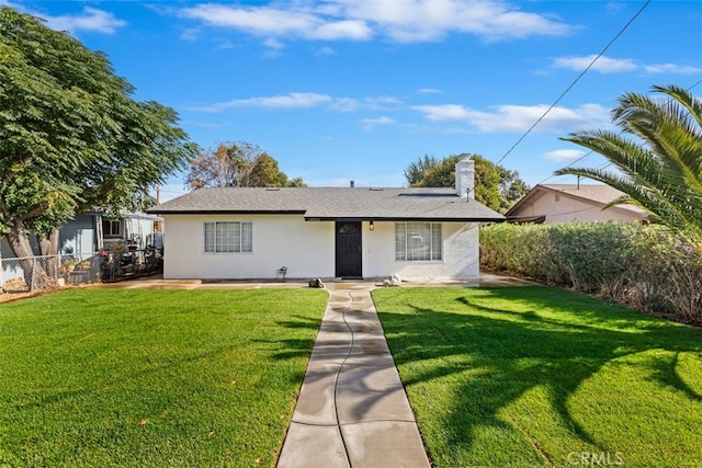 view of front facade with a front lawn