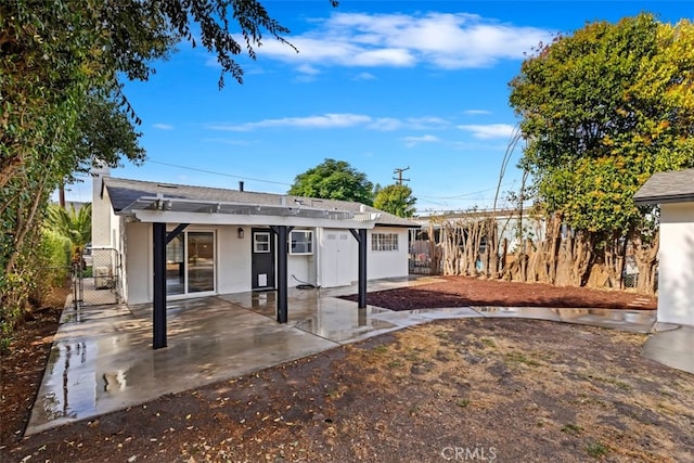 back of house featuring a patio area