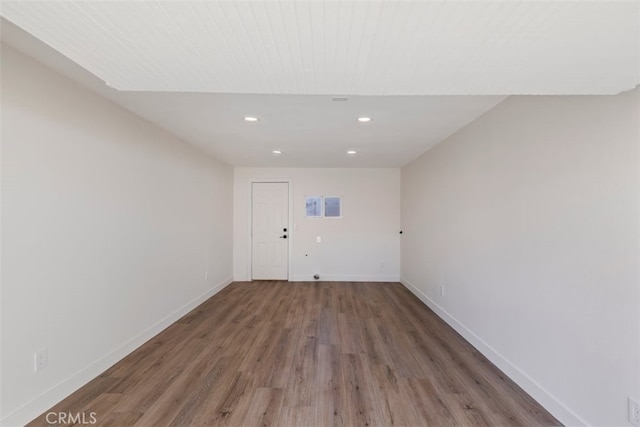 laundry room with dark hardwood / wood-style floors