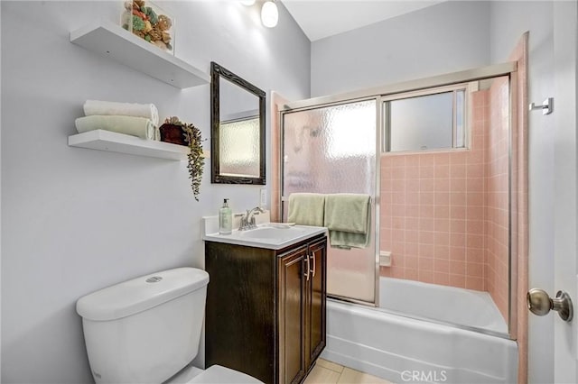 full bathroom with tile patterned floors, vanity, toilet, and enclosed tub / shower combo