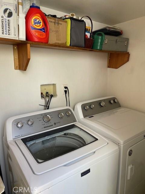 laundry area with washer and dryer