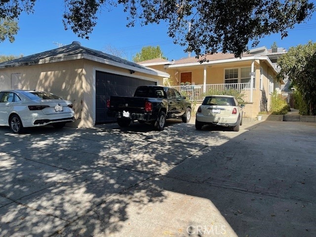 view of front of house with a porch and a garage