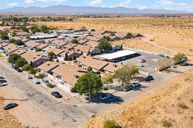 birds eye view of property with a mountain view