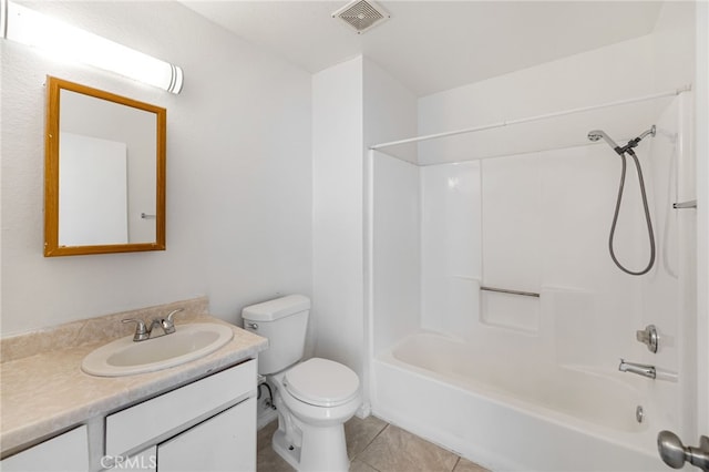 full bathroom with vanity, bathtub / shower combination, tile patterned floors, and toilet