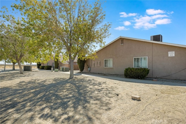 view of side of home with a patio