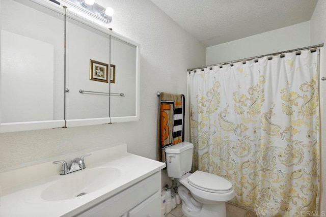 bathroom with vanity, toilet, a textured ceiling, and curtained shower