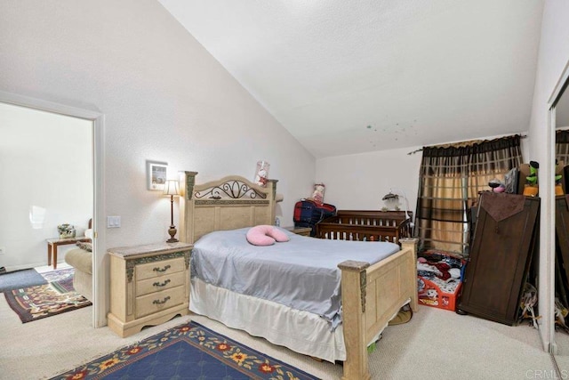 bedroom featuring lofted ceiling and light colored carpet