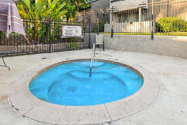 view of pool featuring a hot tub