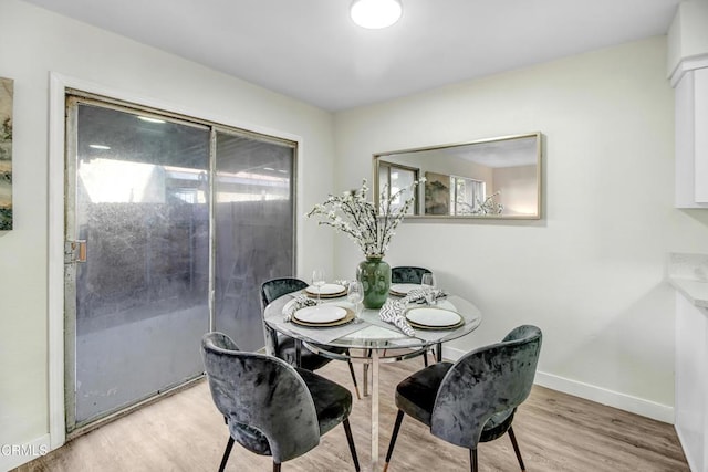 dining space featuring light hardwood / wood-style flooring