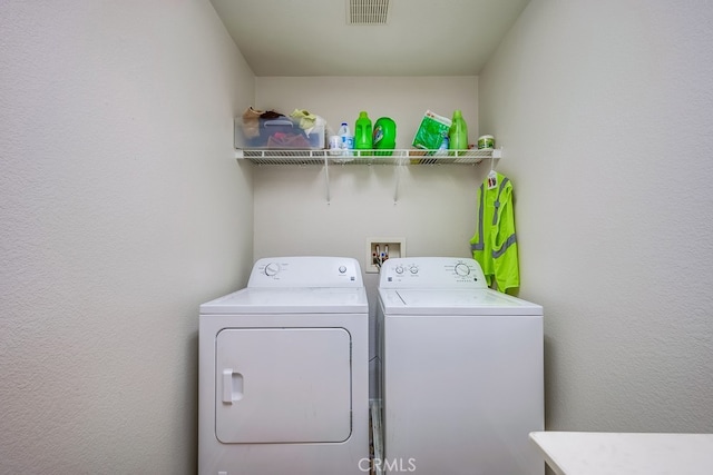 laundry area with washing machine and dryer