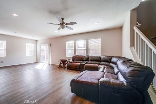 living room featuring hardwood / wood-style flooring and ceiling fan