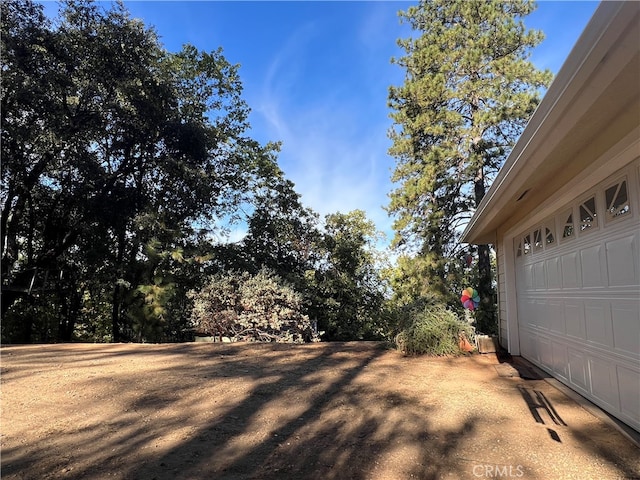 view of yard featuring a garage