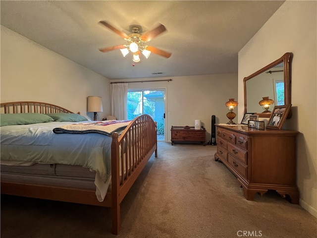 bedroom with carpet, access to exterior, and ceiling fan