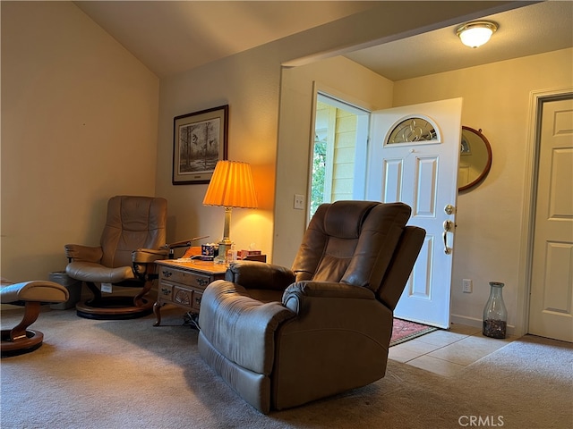 living area featuring lofted ceiling and light carpet