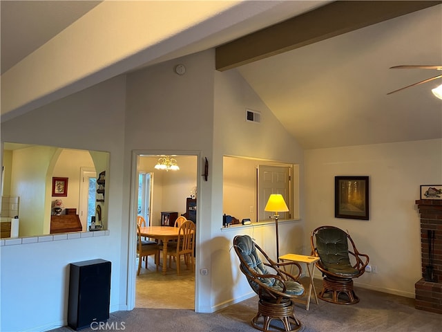 sitting room with ceiling fan, high vaulted ceiling, a brick fireplace, carpet floors, and beamed ceiling