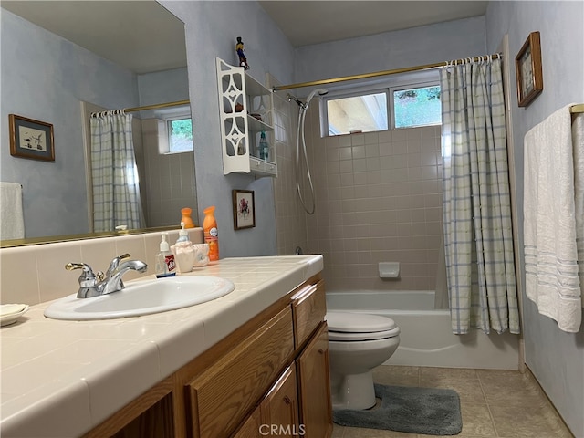 full bathroom with vanity, toilet, shower / bath combo, and tile patterned flooring