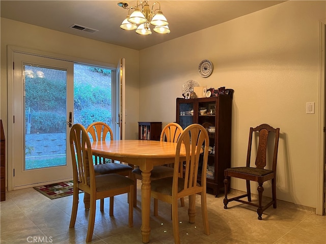 dining space featuring a chandelier