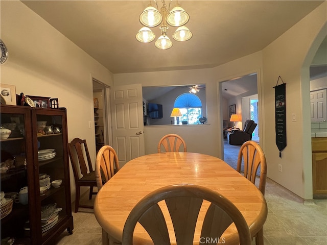 dining space featuring a chandelier and light tile patterned floors