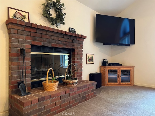 room details featuring a fireplace and carpet floors