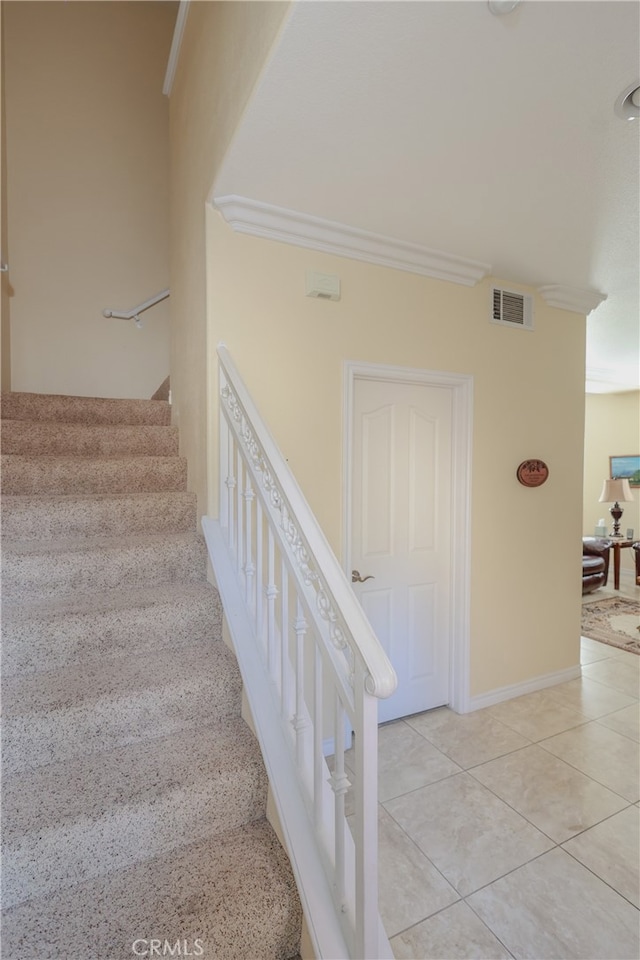 stairs with tile patterned flooring