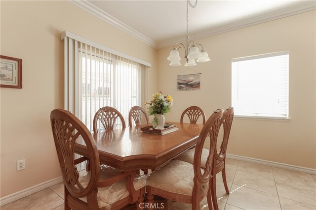 dining space featuring a wealth of natural light, a chandelier, light tile patterned flooring, and crown molding