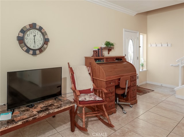 living area featuring crown molding and light tile patterned floors