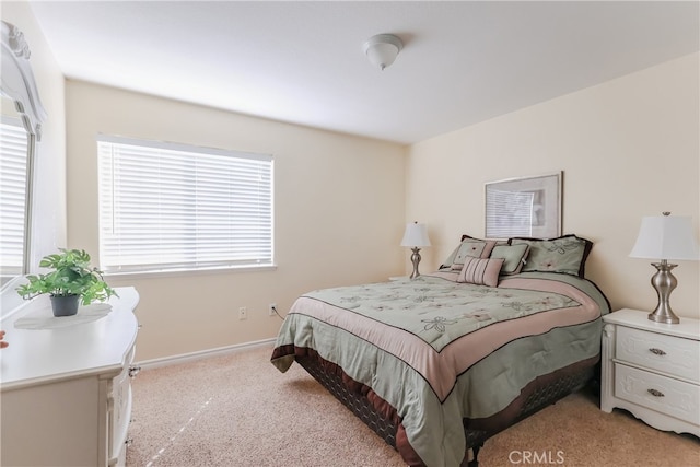 bedroom featuring light colored carpet