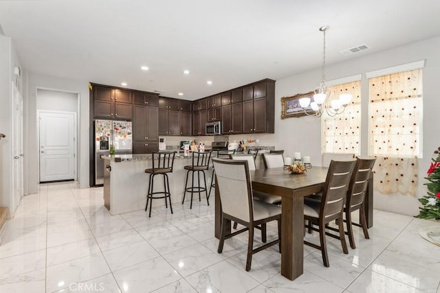 dining room featuring an inviting chandelier