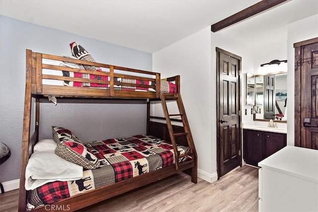 760 Blue Jay Rd Unit 10, Big Bear Lake, CA 92315 - bedroom with light wood-style floors, baseboards, a sink, and connected bathroom