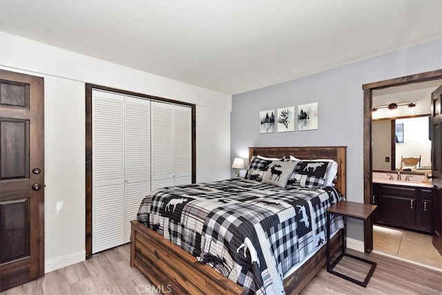 760 Blue Jay Rd Unit 10, Big Bear Lake, CA 92315 - bedroom with light wood finished floors, a closet, baseboards, and ensuite bath
