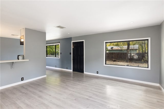 empty room with light wood-type flooring