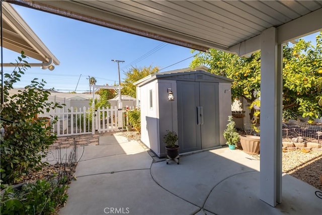 view of patio featuring a storage shed