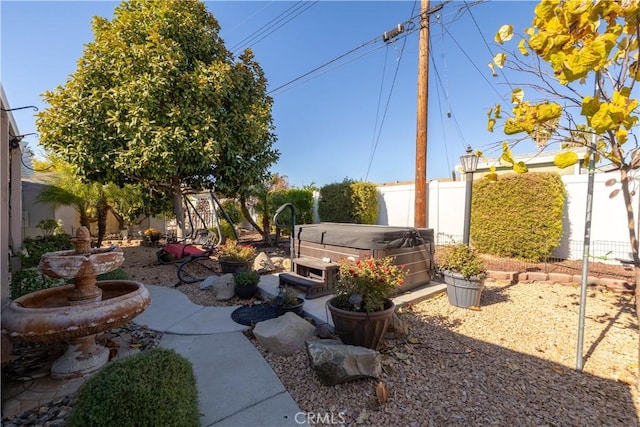 view of yard with a hot tub