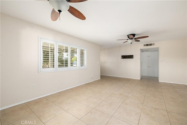 unfurnished room with light tile patterned flooring