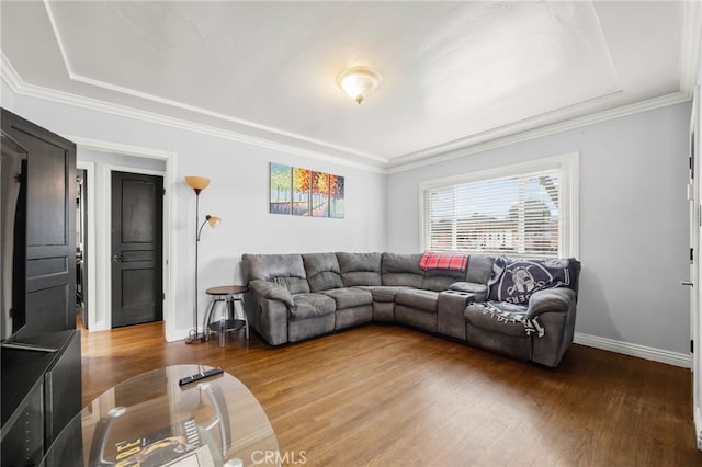 living room with hardwood / wood-style floors and ornamental molding