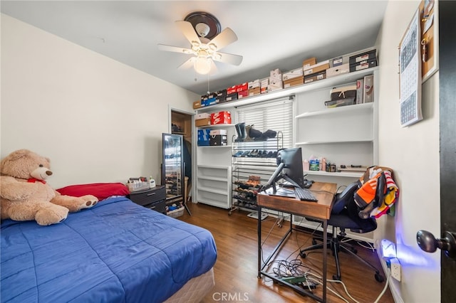 bedroom with ceiling fan and dark wood-type flooring