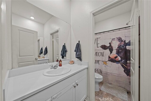 29707 Wolf Glen Ct, Winchester, CA 92596 - full bathroom with toilet, vanity, and a shower with curtain