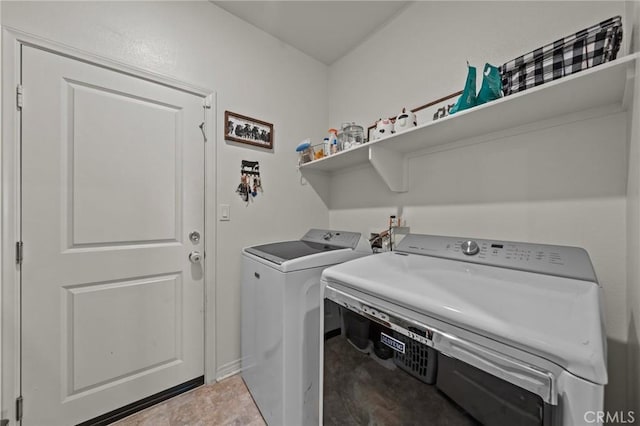 clothes washing area with washer and dryer and laundry area